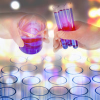 Scientist holding toxic chemicals Scientist holding toxic chemicals